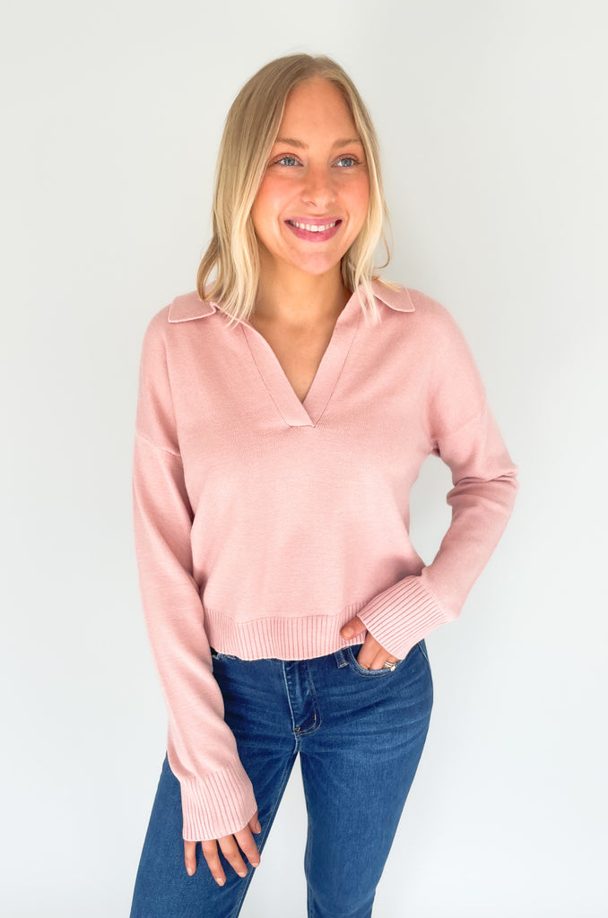 Gray, dusty pink, or charcoal collard sweaters that are cozy and comfortable while still being stylish. Features a ribbed waistline and collar. Hits at the waistline