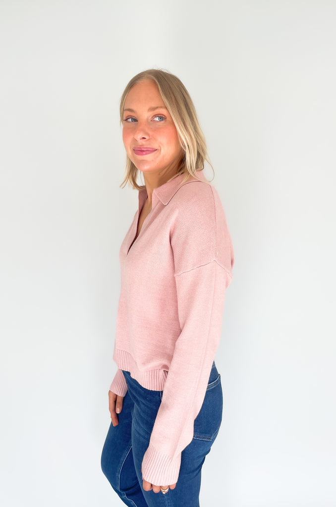 Gray, dusty pink, or charcoal collard sweaters that are cozy and comfortable while still being stylish. Features a ribbed waistline and collar. Hits at the waistline