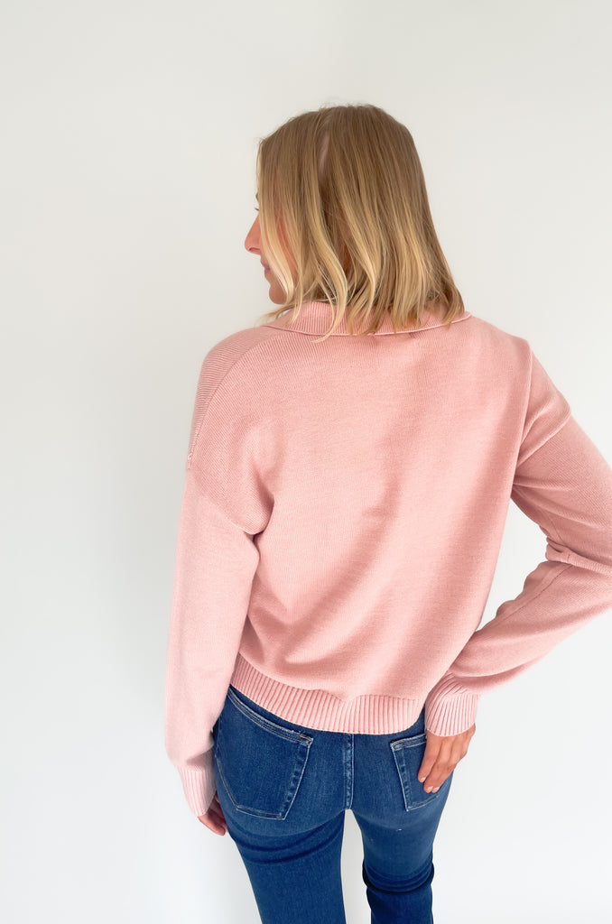 Gray, dusty pink, or charcoal collard sweaters that are cozy and comfortable while still being stylish. Features a ribbed waistline and collar. Hits at the waistline