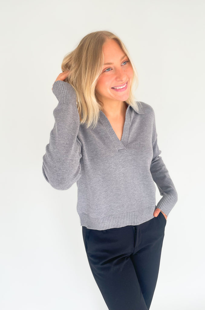 Gray, dusty pink, or charcoal collard sweaters that are cozy and comfortable while still being stylish. Features a ribbed waistline and collar. Hits at the waistline