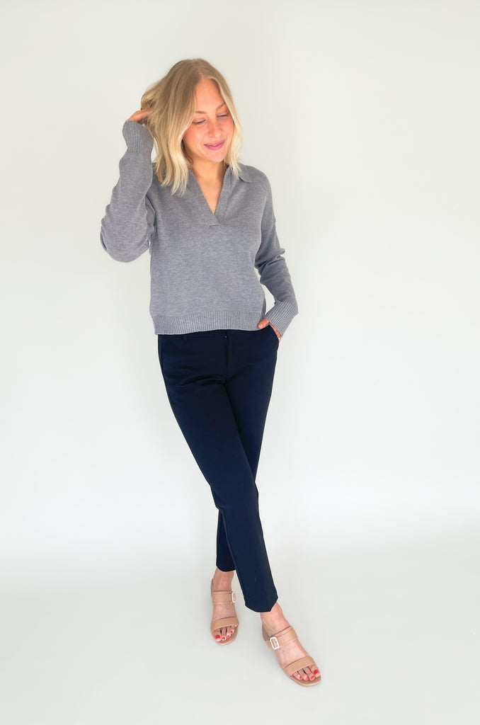 Gray, dusty pink, or charcoal collard sweaters that are cozy and comfortable while still being stylish. Features a ribbed waistline and collar. Hits at the waistline