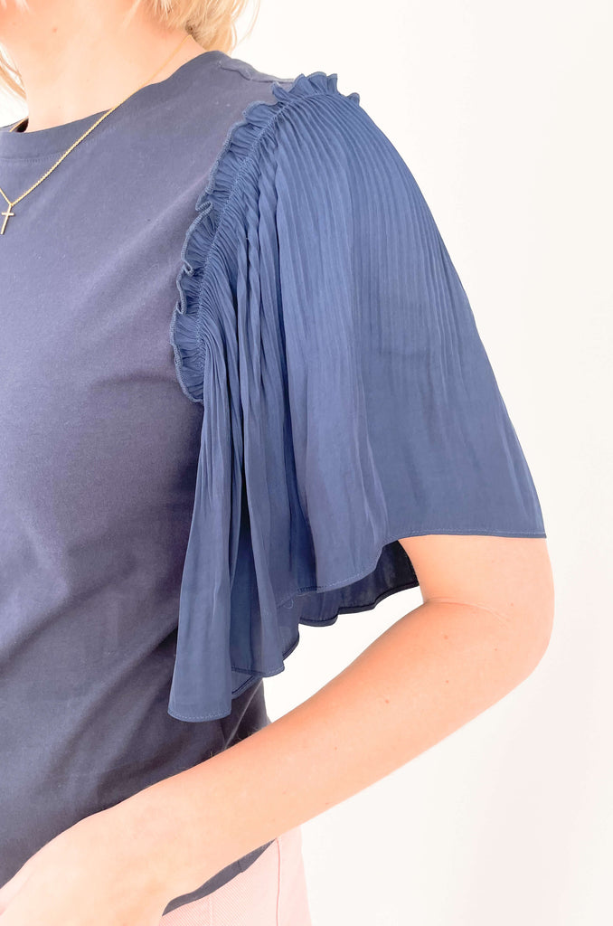 Be a trendsetter in this fluttering, flirty Contrast Pleated Flutter Sleeve Shirt! In a showstopping silhouette, you'll have everyone's eyes on you. Super silky sleeves, with pleats of perfection and contrast body, this blouse is perfect for special events, date night, birthdays, you name it! 