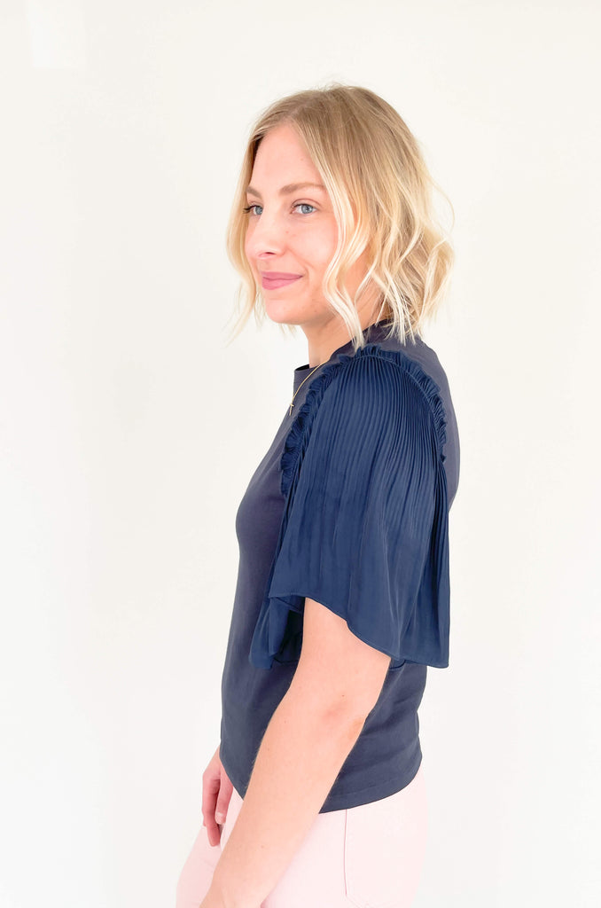 Be a trendsetter in this fluttering, flirty Contrast Pleated Flutter Sleeve Shirt! In a showstopping silhouette, you'll have everyone's eyes on you. Super silky sleeves, with pleats of perfection and contrast body, this blouse is perfect for special events, date night, birthdays, you name it! 