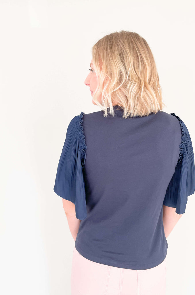 Be a trendsetter in this fluttering, flirty Contrast Pleated Flutter Sleeve Shirt! In a showstopping silhouette, you'll have everyone's eyes on you. Super silky sleeves, with pleats of perfection and contrast body, this blouse is perfect for special events, date night, birthdays, you name it! 
