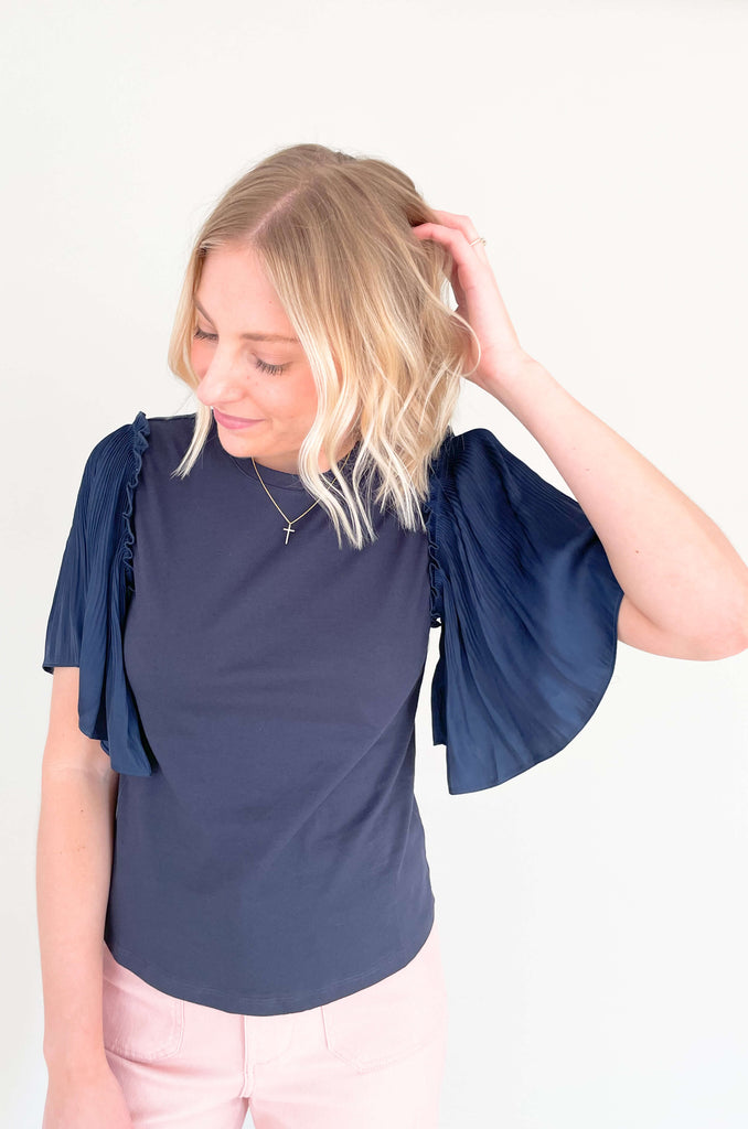 Be a trendsetter in this fluttering, flirty Contrast Pleated Flutter Sleeve Shirt! In a showstopping silhouette, you'll have everyone's eyes on you. Super silky sleeves, with pleats of perfection and contrast body, this blouse is perfect for special events, date night, birthdays, you name it! 