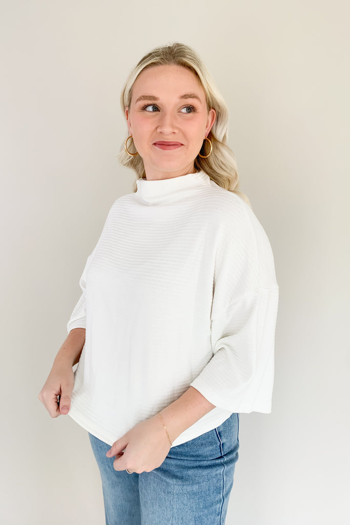 Find confidence in our new Corinne Sweater! This elevated combo between a tee and a sweater creates the perfect blend of comfort and elegance. It features a cowl neckline and flowy batwing 3/4 sleeves with ribbing for extra texture. Fun and confident, this sweater is perfect for any outfit!