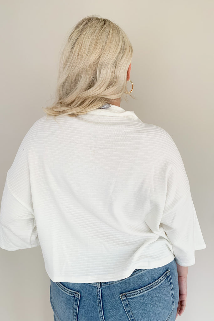 Find confidence in our new Corinne Sweater! This elevated combo between a tee and a sweater creates the perfect blend of comfort and elegance. It features a cowl neckline and flowy batwing 3/4 sleeves with ribbing for extra texture. Fun and confident, this sweater is perfect for any outfit!