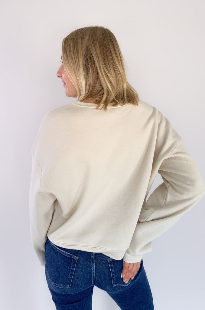We took our beloved graphics up a notch with this NEW Cowboy Take Me Away Midi Sweatshirt! With the same cozy fleece lining and stretch, it's the perfect combo of cute and casual. Now in a semi-cropped fit, hitting just at the waist with a fun graphic