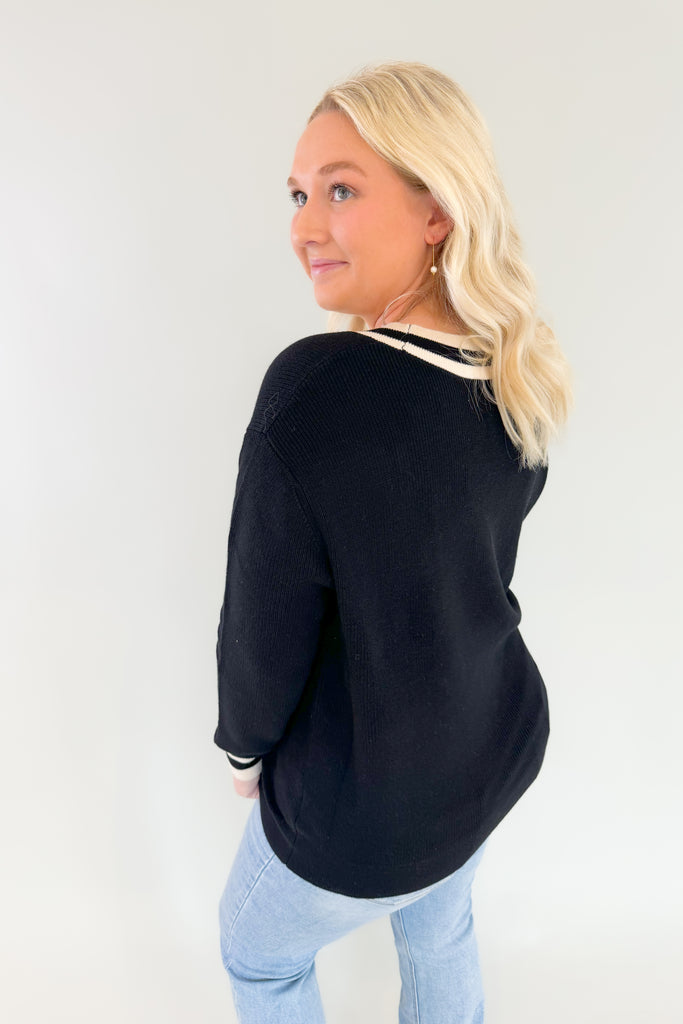 This Collared Dual V Sweater is the perfect combination of cozy comfort and timeless style! With elevated fabric and soft feel, you'll look and feel your best in any setting. It has a preppy flare with the black and white stripe details along the neck and sleeves. This sweater is undoubtedly a comfortable option for everyday. It would also be great for Iowa fans. 