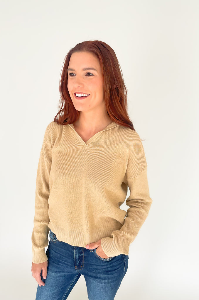Beige v-neck knit sweater with a hood with a loose fit