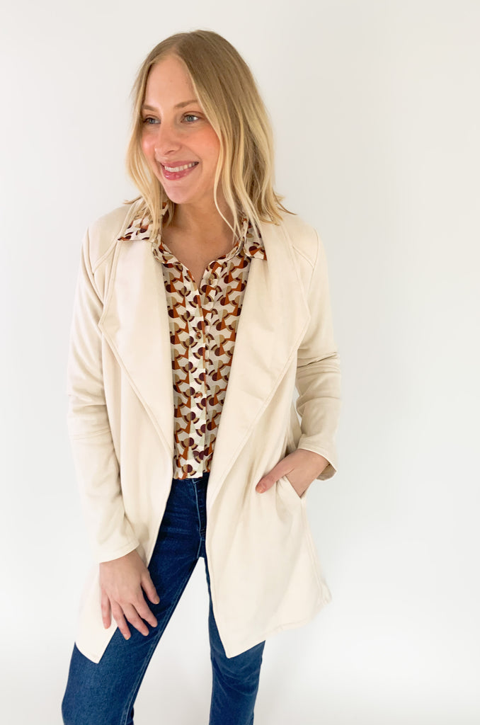 faux suede jacket that exudes sophistication with its collared details and drape front cut, while remaining lightweight and comfortable- available in ecru and dusty lavender