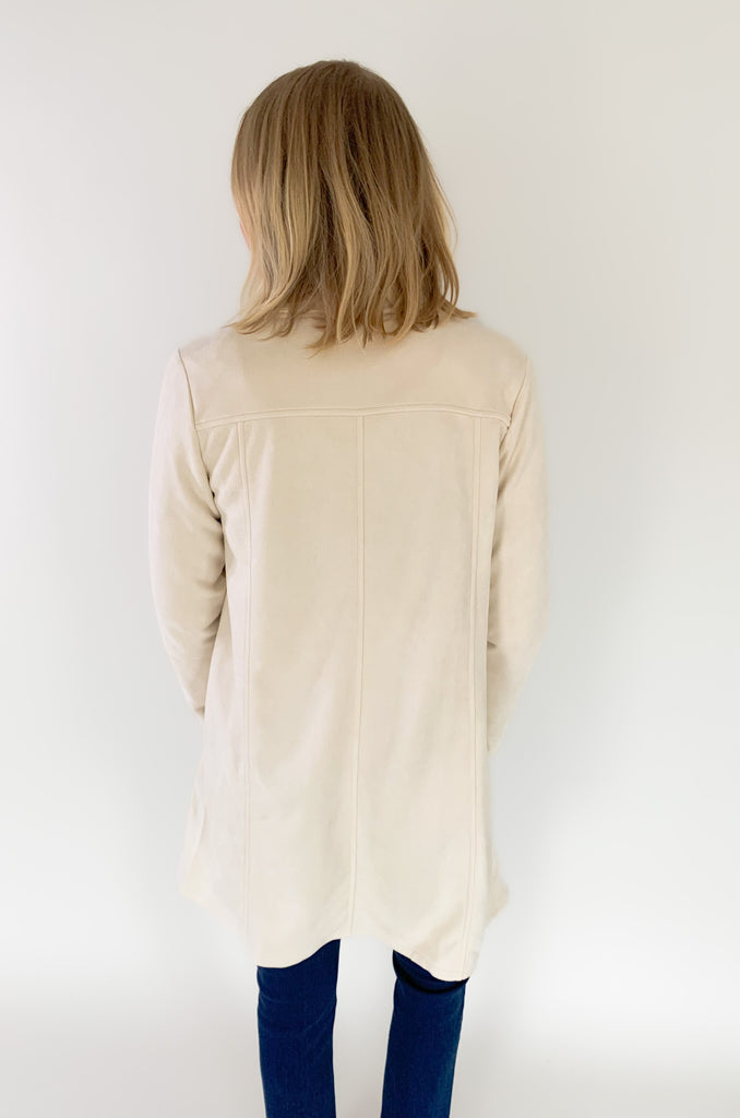 faux suede jacket that exudes sophistication with its collared details and drape front cut, while remaining lightweight and comfortable- available in ecru and dusty lavender