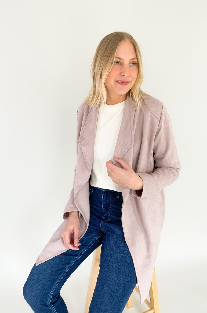 faux suede jacket that exudes sophistication with its collared details and drape front cut, while remaining lightweight and comfortable- available in ecru and dusty lavender