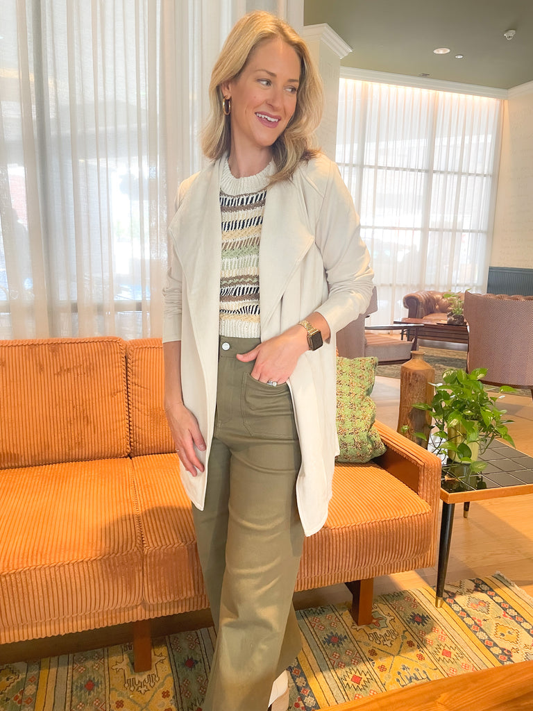 faux suede jacket that exudes sophistication with its collared details and drape front cut, while remaining lightweight and comfortable- available in ecru and dusty lavender