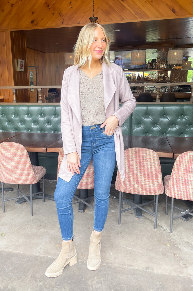 faux suede jacket that exudes sophistication with its collared details and drape front cut, while remaining lightweight and comfortable- available in ecru and dusty lavender