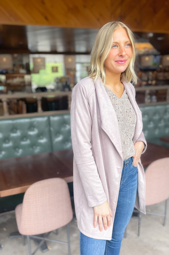 faux suede jacket that exudes sophistication with its collared details and drape front cut, while remaining lightweight and comfortable- available in ecru and dusty lavender