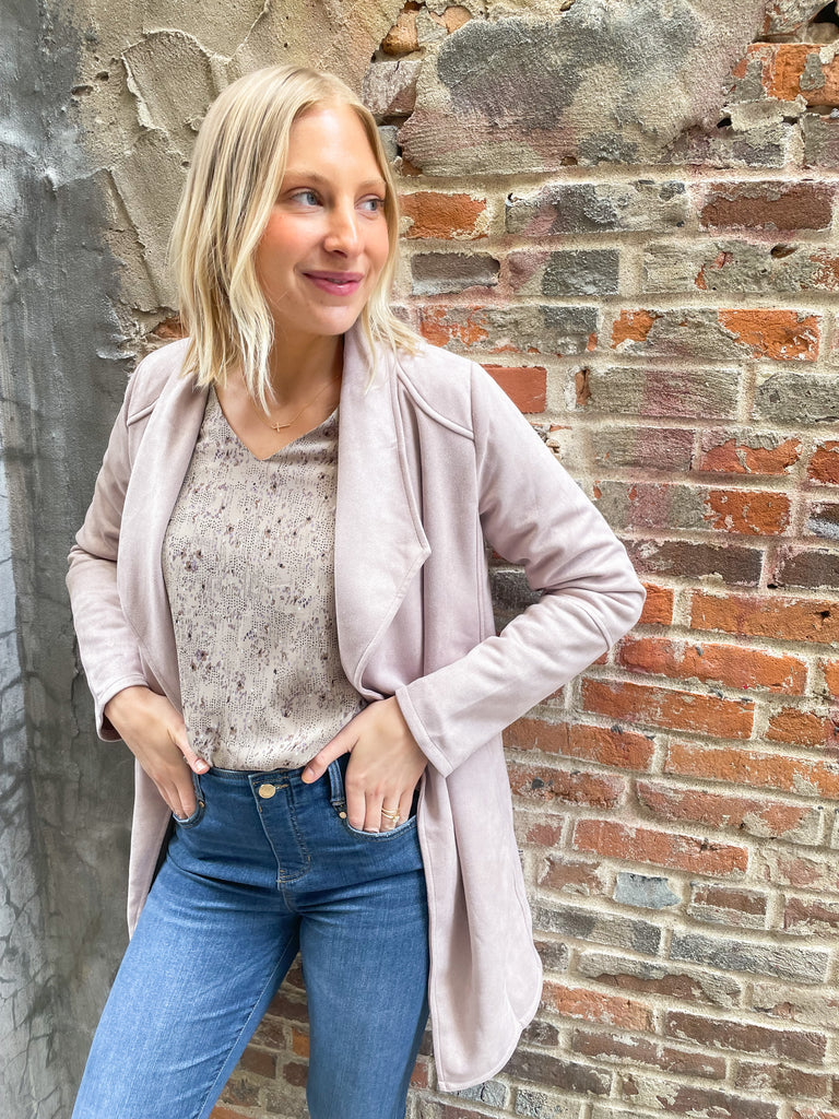 faux suede jacket that exudes sophistication with its collared details and drape front cut, while remaining lightweight and comfortable- available in ecru and dusty lavender
