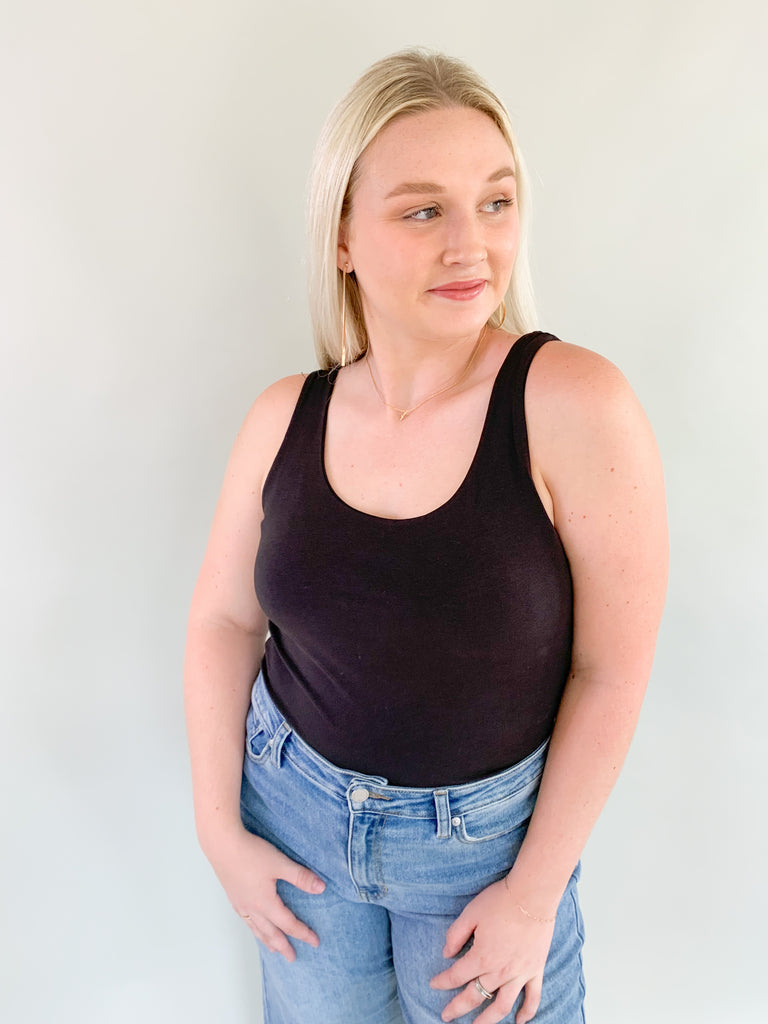 The Dolo Double Lined Tank is super soft and elevated with a banded hem for security. You can tuck it into your bottoms with confidence that it's there to stay! The double lined material is very elevated too. 