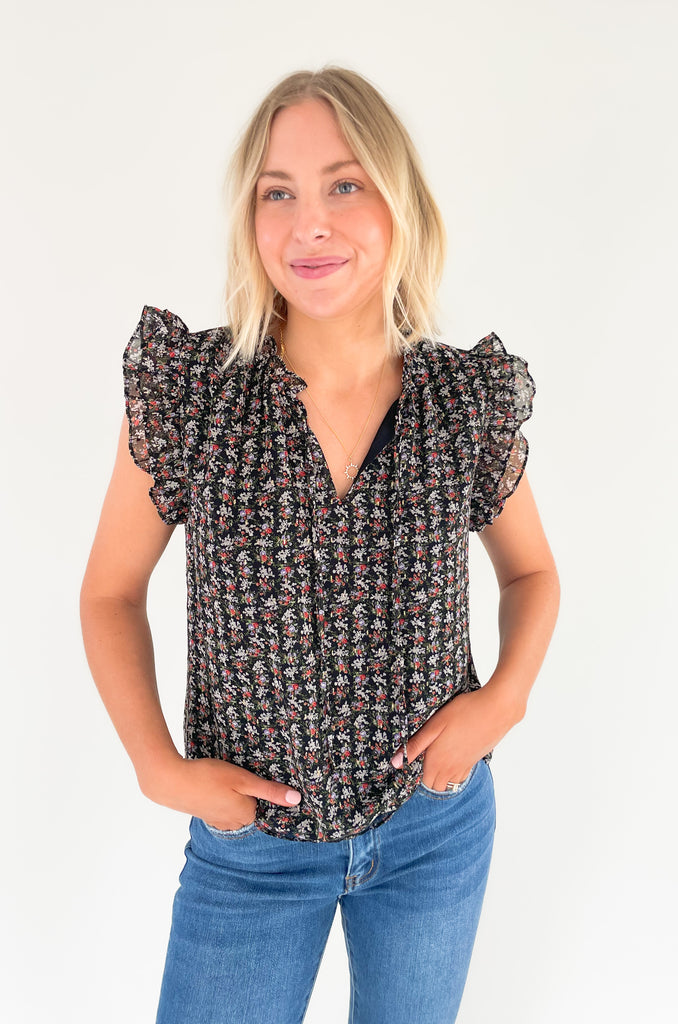 This stunning top is made of a lightweight, sheer material with a matching underlay for an elegant touch. Delicate gold thread runs throughout the shirt, while the ruffle sleeves and drawstring neckline add extra flair and structure. Perfect for any occasion, this top will make a statement.