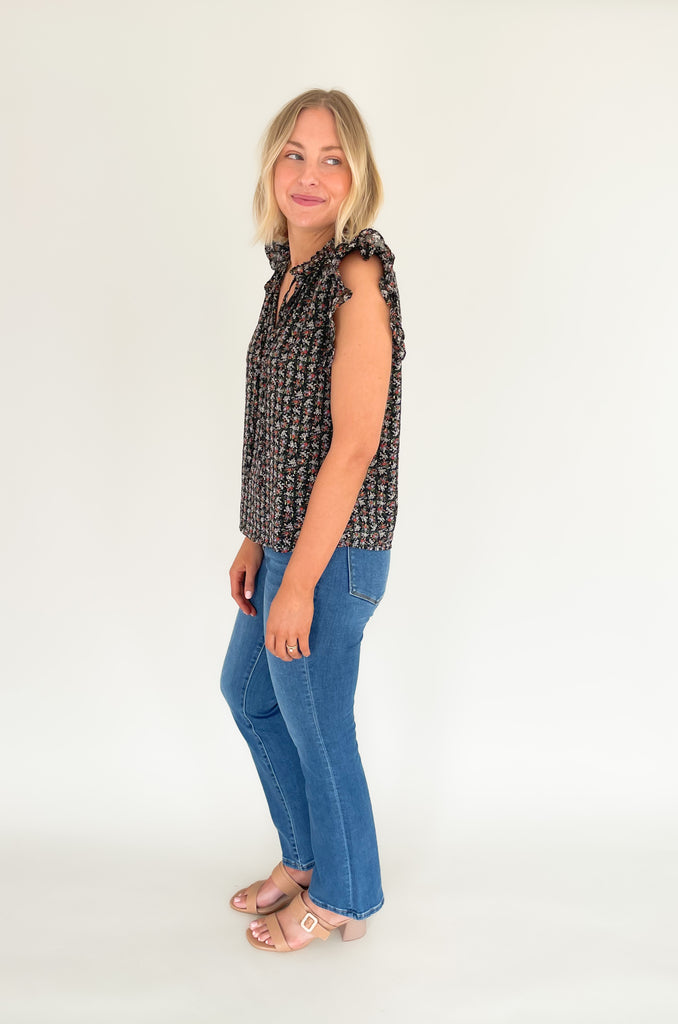 This stunning top is made of a lightweight, sheer material with a matching underlay for an elegant touch. Delicate gold thread runs throughout the shirt, while the ruffle sleeves and drawstring neckline add extra flair and structure. Perfect for any occasion, this top will make a statement.
