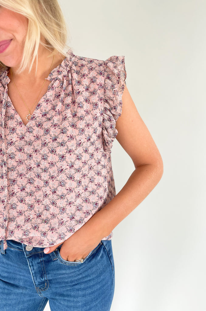 This stunning top is made of a lightweight, sheer material with a matching underlay for an elegant touch. Delicate gold thread runs throughout the shirt, while the ruffle sleeves and drawstring neckline add extra flair and structure. Perfect for any occasion, this top will make a statement.