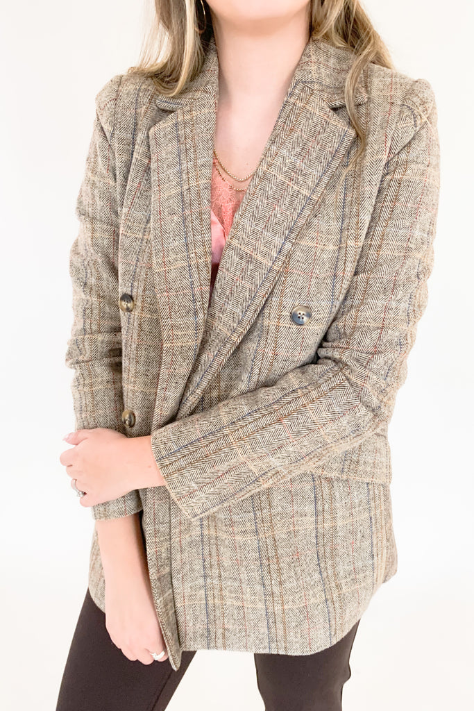 This Double Breasted Herringbone Blazer by Molly Bracken contains threads of mixed blue, mauve, and rust. The mixed colors are so unique, making it easy to match with multiple looks. We paired it with our new Dianne Lace Trim Satin Cami. Its lightweight lining adds softness and comfort, making it perfect for formal or everyday wear. 