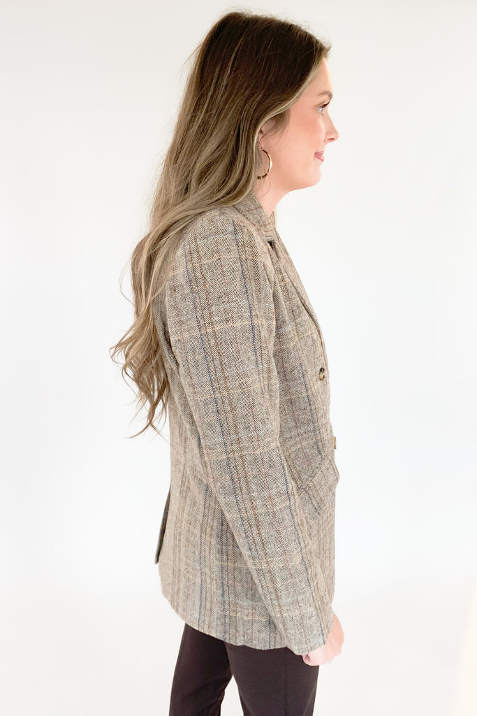 This Double Breasted Herringbone Blazer by Molly Bracken contains threads of mixed blue, mauve, and rust. The mixed colors are so unique, making it easy to match with multiple looks. We paired it with our new Dianne Lace Trim Satin Cami. Its lightweight lining adds softness and comfort, making it perfect for formal or everyday wear. 