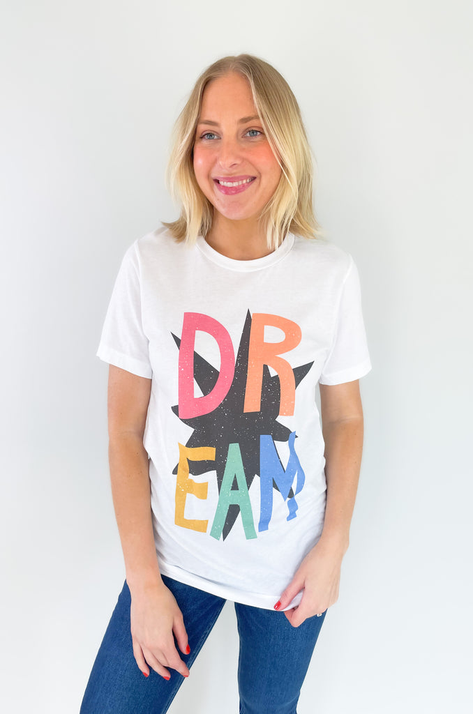 round neck short sleeve graphic tee with "DREAM" colorful text and black star print