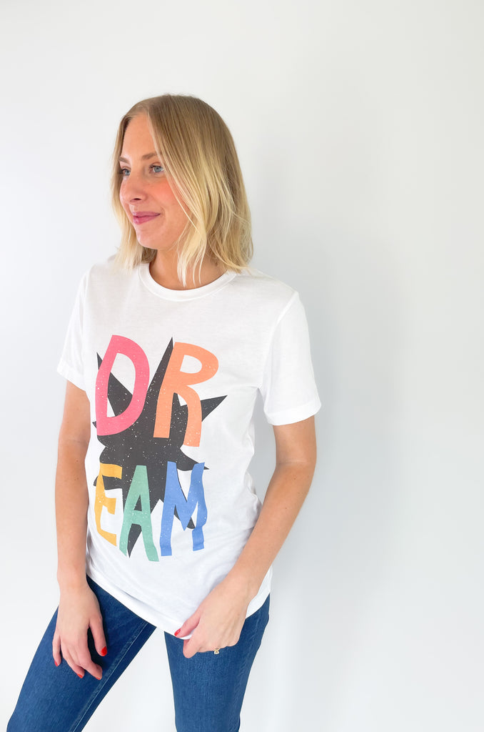 round neck short sleeve graphic tee with "DREAM" colorful text and black star print. perfect for teachers on the go