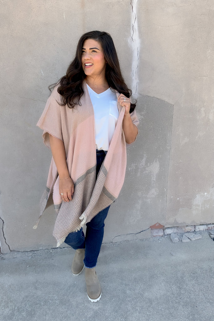 The Dusty Pink Checkered Kimono is lightweight and comfortable for everyday wear! It's easy to throw on a kimono and go for a no-fuss look. We love the soft fabric and pink details too. 