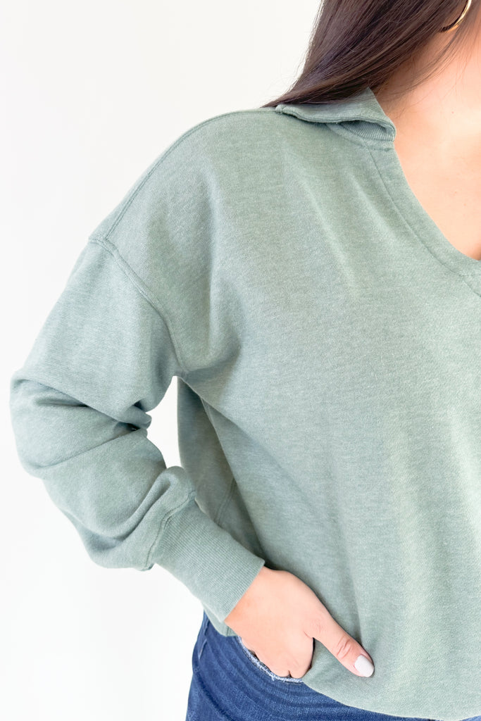 organic cotton soft fleece pullover with v neckline and collared details
