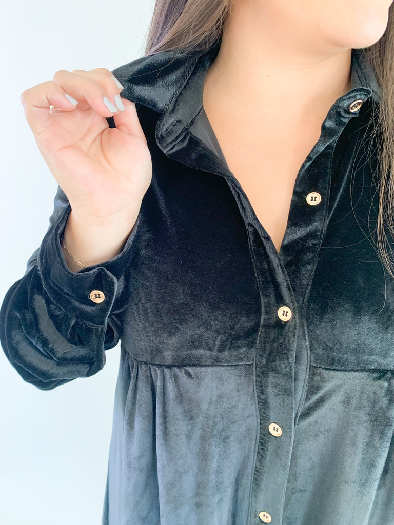 This luxurious jet black dress is perfect for any special event! Crafted with buttery-soft velvet fabric and finished with gold buttons, this dress will instantly elevate any look. It's perfect of holiday parties, family pictures, you name it! Plus, the fabric is very soft and stretchy. Pair it with tights on a chilly day for a chic look. 
