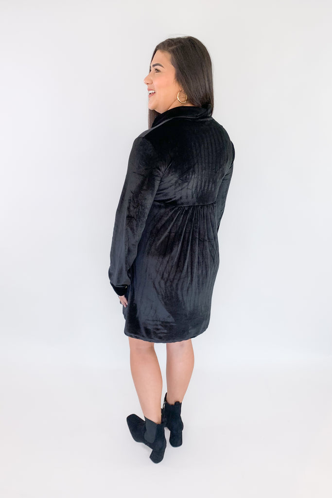 This luxurious jet black dress is perfect for any special event! Crafted with buttery-soft velvet fabric and finished with gold buttons, this dress will instantly elevate any look. It's perfect of holiday parties, family pictures, you name it! Plus, the fabric is very soft and stretchy. Pair it with tights on a chilly day for a chic look. 