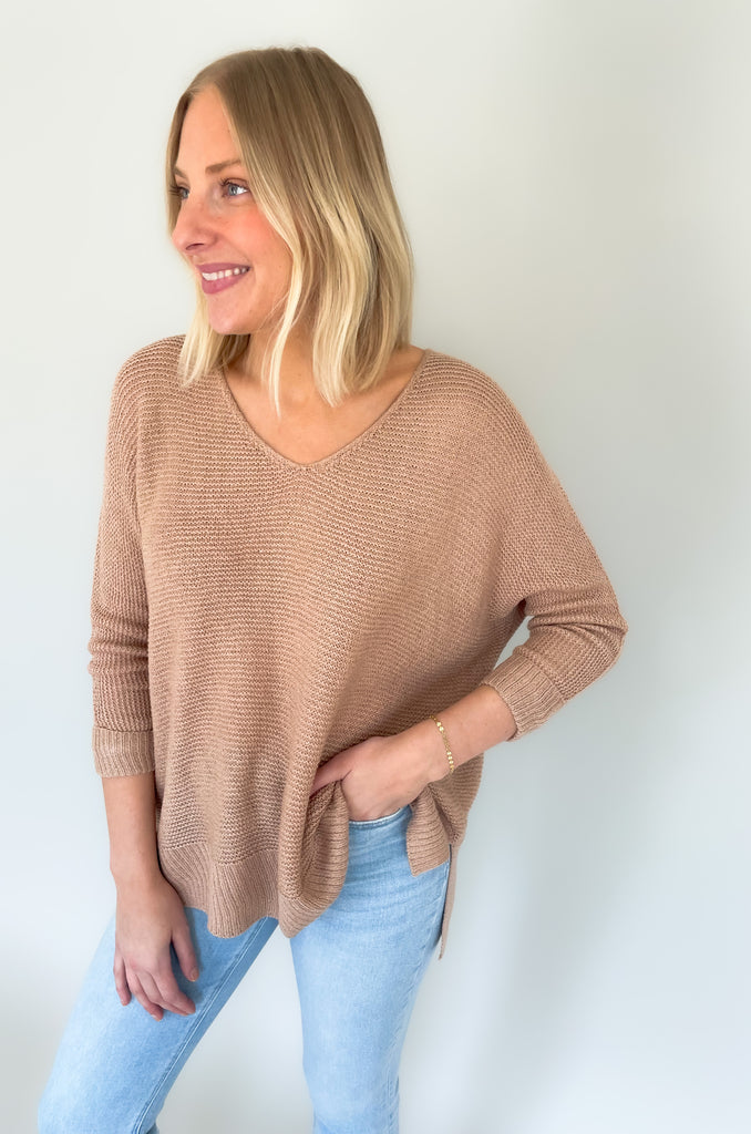 Look your best with the Ethel V Neck Sweater! Knitted from lightweight fabric, this stylish piece will keep you comfortable while making a statement. The v-neck cut adds a modern touch, Cuffed arms, and a flattering side slit ensures you can enjoy it all day long. It's oversized and so comfortable!