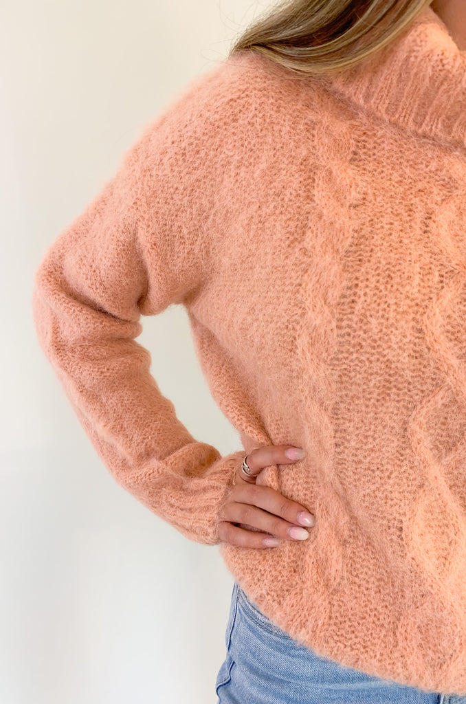 The Molly Bracken Eyelash Cable Knit Turtleneck Sweater is so pretty and luxe! The fabric is super soft with a unique eyelash cable knit fabric. The oversized chunky turtleneck look could not be more classic than this. You can dress it up or down for so many occasions. 