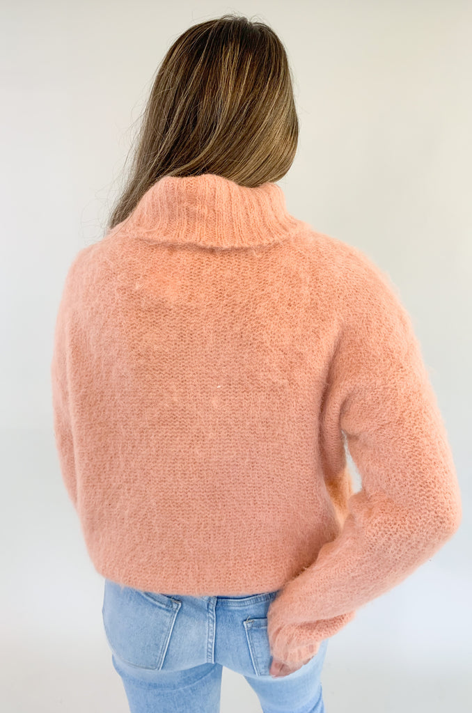 The Molly Bracken Eyelash Cable Knit Turtleneck Sweater is so pretty and luxe! The fabric is super soft with a unique eyelash cable knit fabric. The oversized chunky turtleneck look could not be more classic than this. You can dress it up or down for so many occasions. 