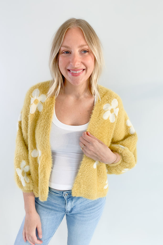 The Eyelash Daisy Cardigan is so cute and very groovy! If you are loving the 70s style trend, this layering piece is for you. It's ultra soft and cozy with fun balloon sleeves and a cropped silhouette. 