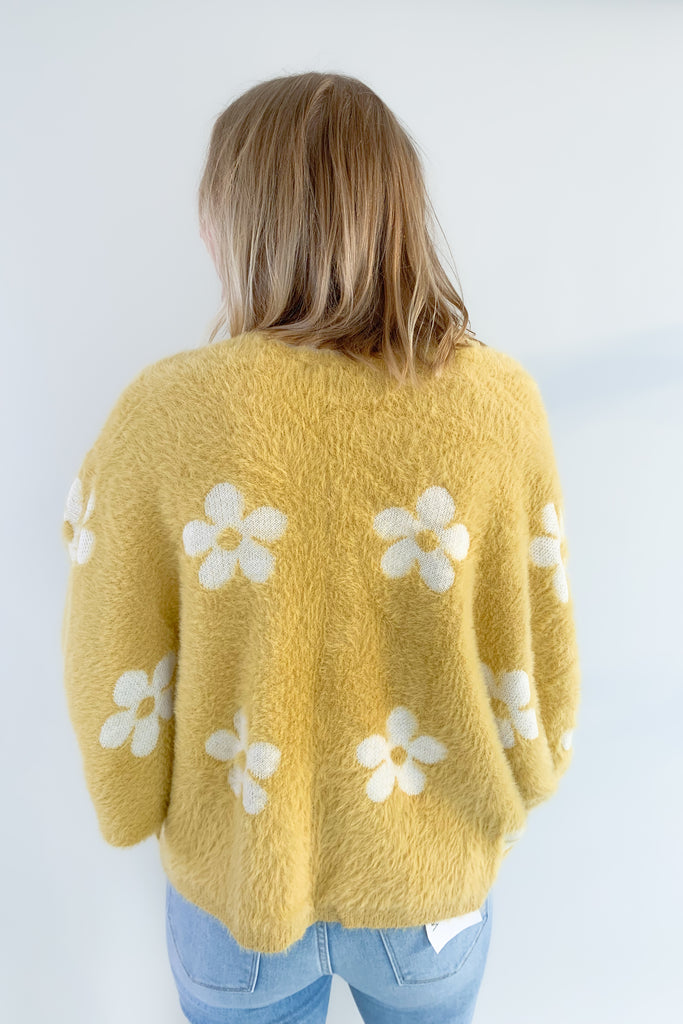 The Eyelash Daisy Cardigan is so cute and very groovy! If you are loving the 70s style trend, this layering piece is for you. It's ultra soft and cozy with fun balloon sleeves and a cropped silhouette. 