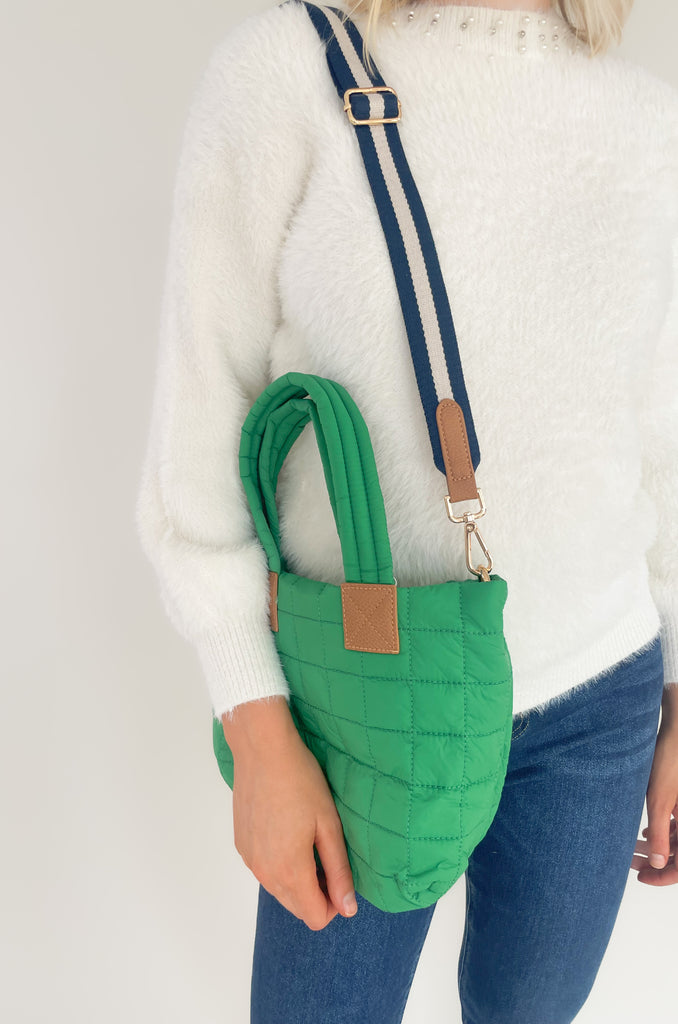 The Ezra Mini Tote Crossbody is perfect for on the go! The quilted design is right on trend while also being lightweight and elevated. It also washes easily- a major win! These bags come with a detachable fabric shoulder straps and faux leather details. On the inside, there are multiple pockets for storage and a zip enclosure. Choose between ivory, camel, or green to complete your look! 