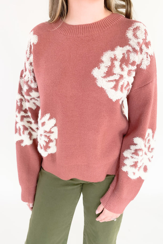 Be sure to turn heads this season with our Fabulous Floral Crewneck Sweater! Crafted from a super soft and stretchy fabric, you will be feeling cozy and warm. This fashion piece features a white contrast abstract floral stitching, creating a unique look. You can easily dress this sweater up or down for countless events! 