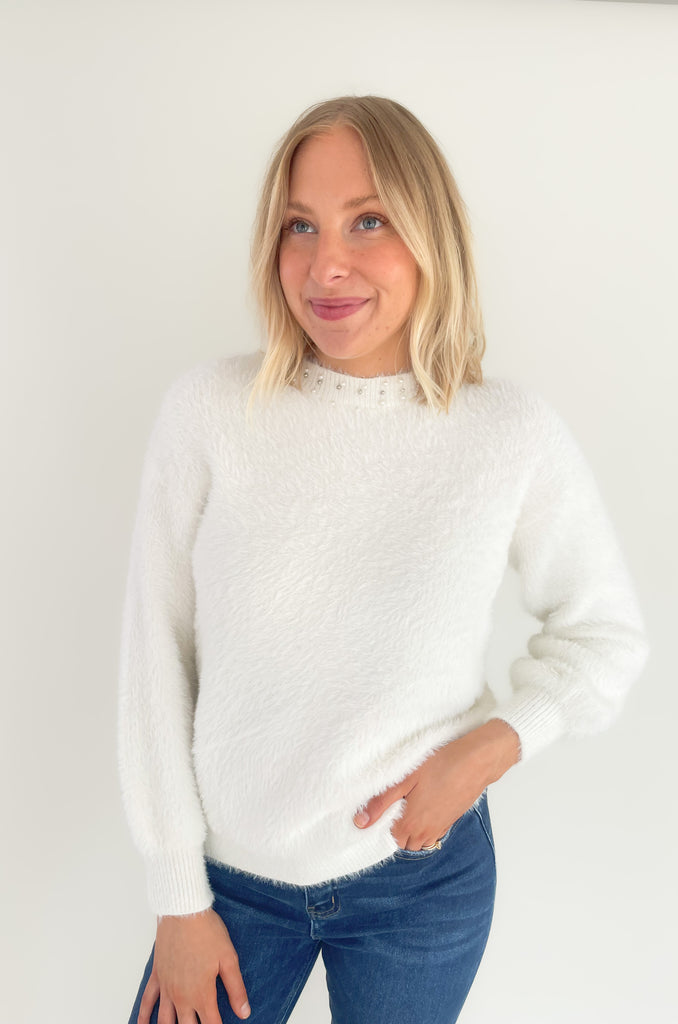 Our new Molly Bracken Pullover features a row of elegant pearls and comes in two classic colors! If you feel the fabric, you will instantly fall in love with the softness. This sweater has an ultra cozy eyelash fabrication, making if so cozy for the holiday season. You could totally dress it up to wear to holiday parties, works, and all the special days in between. 