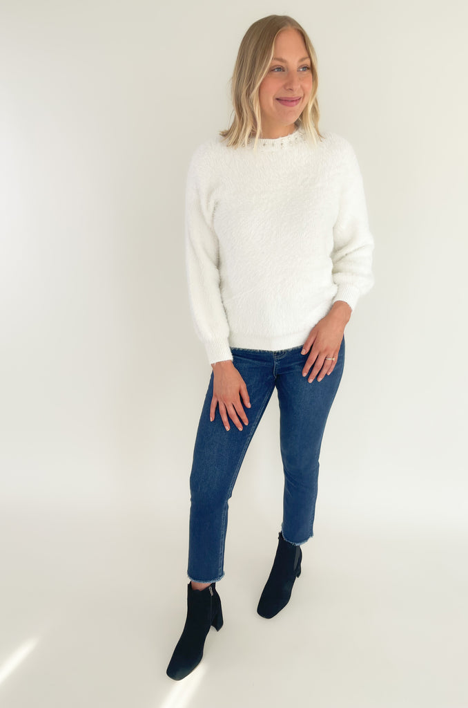 Our new Molly Bracken Pullover features a row of elegant pearls and comes in two classic colors! If you feel the fabric, you will instantly fall in love with the softness. This sweater has an ultra cozy eyelash fabrication, making if so cozy for the holiday season. You could totally dress it up to wear to holiday parties, works, and all the special days in between. 