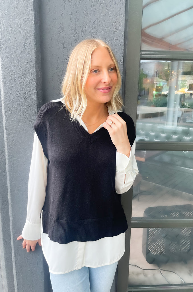 Stay stylish when the weather cools down with the Elan Geist Black Sweater Vest & Layered Blouse! This unique one-piece is made of knit fabric to keep you warm and comfortable, while featuring a flattering satin blouse underneath.