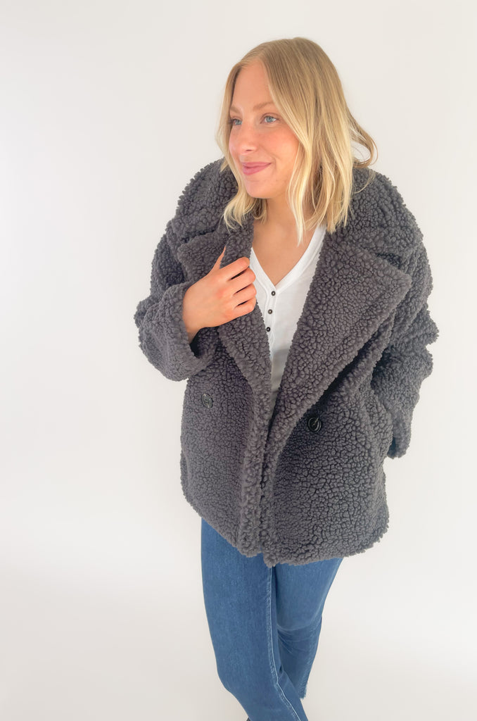 The UGG Gertrude Short Teddy Coat is a statement piece you can keep in your closet for years to come! It is incredibly soft with a double-breasted front, lots of texture, and incredible fit. This UGG style features faux fleece- offering warmth while feeling very light and comfortable.
