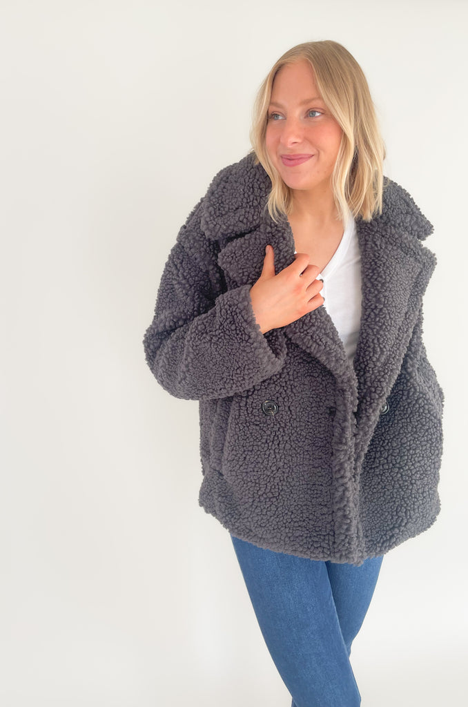 The UGG Gertrude Short Teddy Coat is a statement piece you can keep in your closet for years to come! It is incredibly soft with a double-breasted front, lots of texture, and incredible fit. This UGG style features faux fleece- offering warmth while feeling very light and comfortable.