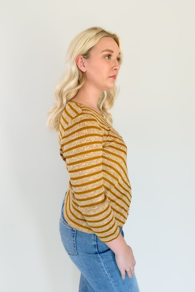 This beautiful Liverpool Gold Stripe 3/4 Sleeve Scoop Neck Top features a unique mitering detail on the front with a scoop neckline. The color and print is unique too. If you are looking of an elevated everyday favorite, this one is a great option. It pairs back to denim effortlessly!