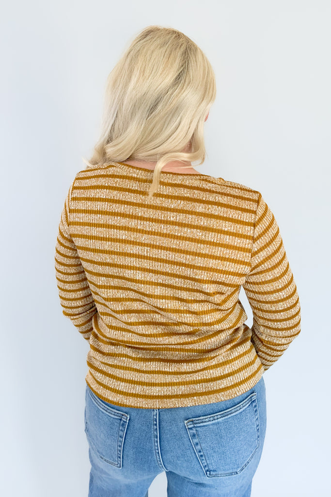 This beautiful Liverpool Gold Stripe 3/4 Sleeve Scoop Neck Top features a unique mitering detail on the front with a scoop neckline. The color and print is unique too. If you are looking of an elevated everyday favorite, this one is a great option. It pairs back to denim effortlessly!