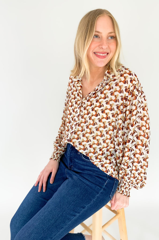 This Terracotta Geometric Printed Cuffed Button Down is the perfect way to add a classic yet stylish look to your wardrobe. Lightweight sheer material, a traditional collar, and cuffed wrists make it versatile for any temperature or occasion! Make an impression with this stylish piece! 