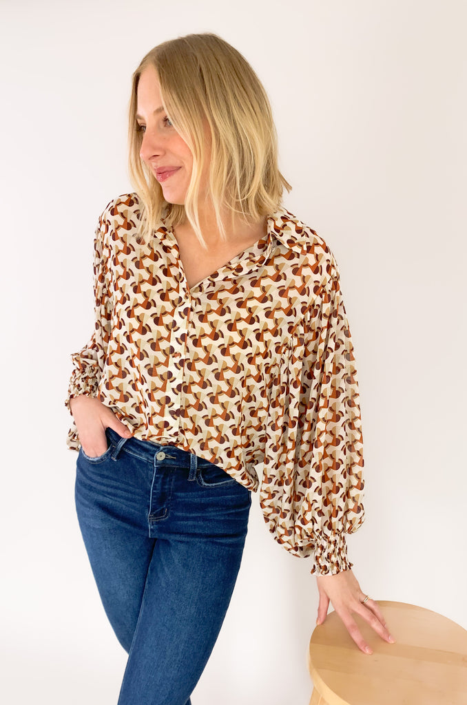 This Terracotta Geometric Printed Cuffed Button Down is the perfect way to add a classic yet stylish look to your wardrobe. Lightweight sheer material, a traditional collar, and cuffed wrists make it versatile for any temperature or occasion! Make an impression with this stylish piece! 