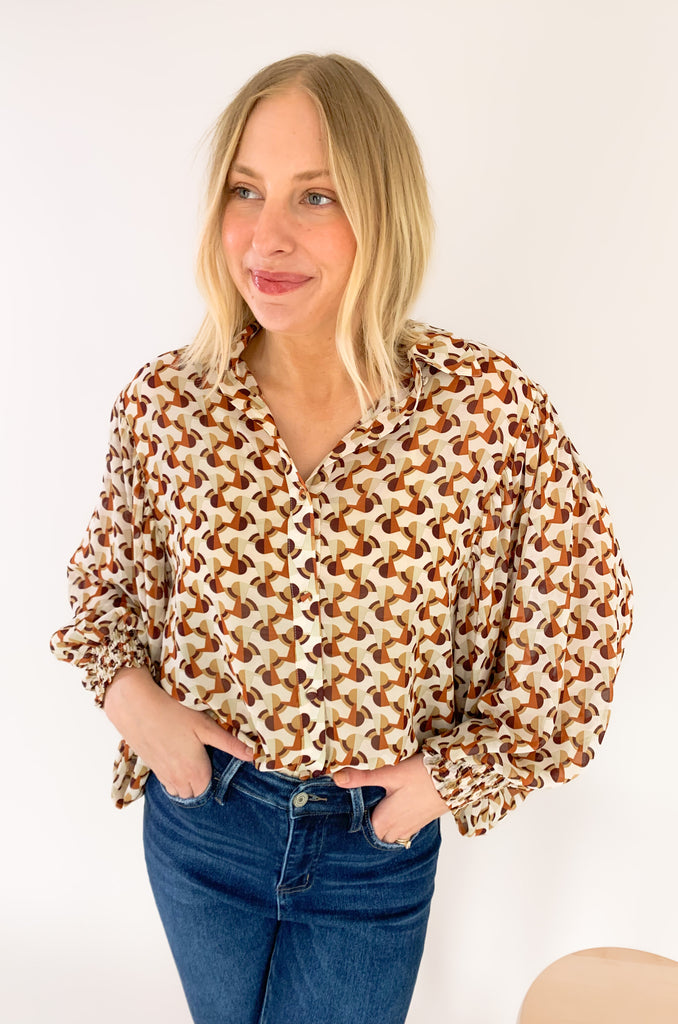 This Terracotta Geometric Printed Cuffed Button Down is the perfect way to add a classic yet stylish look to your wardrobe. Lightweight sheer material, a traditional collar, and cuffed wrists make it versatile for any temperature or occasion! Make an impression with this stylish piece! 